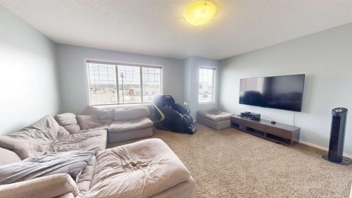 983 Auburn Bay Boulevard Se, Calgary, AB - Indoor Photo Showing Living Room