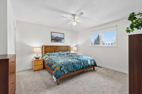 584 Woodhill Place Sw, Calgary, AB - Indoor Photo Showing Bedroom