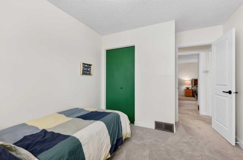 584 Woodhill Place Sw, Calgary, AB - Indoor Photo Showing Bedroom