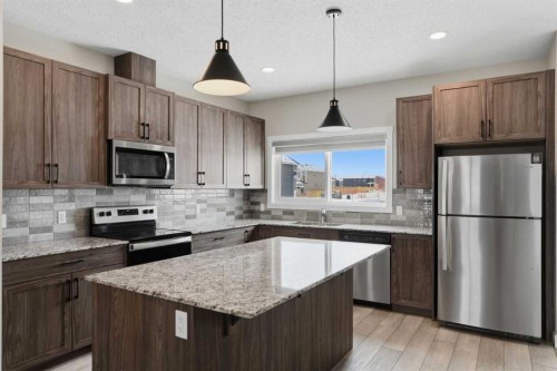 747 Creekside Boulevard Sw, Calgary, AB - Indoor Photo Showing Kitchen With Stainless Steel Kitchen With Upgraded Kitchen