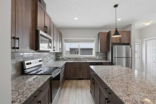 747 Creekside Boulevard Sw, Calgary, AB - Indoor Photo Showing Kitchen With Stainless Steel Kitchen With Upgraded Kitchen