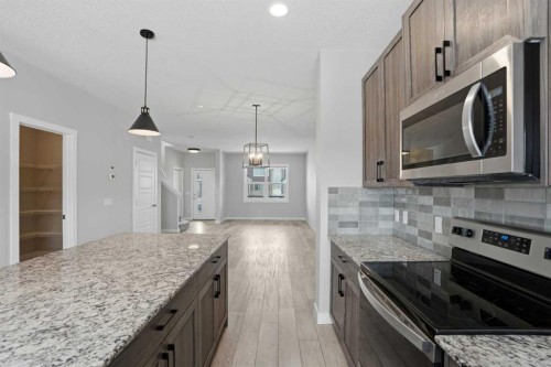 747 Creekside Boulevard Sw, Calgary, AB - Indoor Photo Showing Kitchen With Upgraded Kitchen