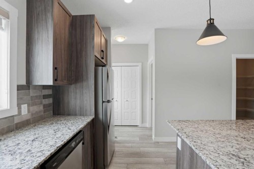 747 Creekside Boulevard Sw, Calgary, AB - Indoor Photo Showing Kitchen With Upgraded Kitchen