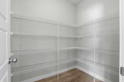 747 Creekside Boulevard Sw, Calgary, AB - Indoor With Storage
