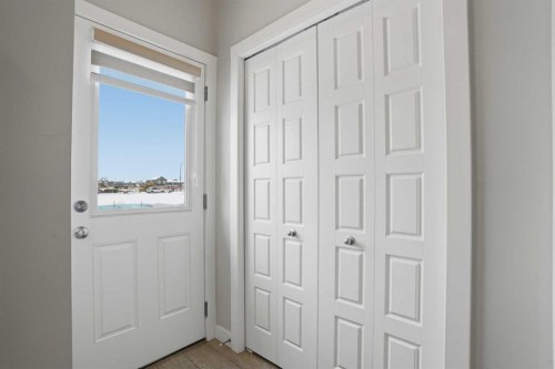 747 Creekside Boulevard Sw, Calgary, AB - Indoor Photo Showing Other Room