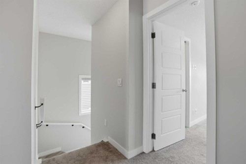 747 Creekside Boulevard Sw, Calgary, AB - Indoor Photo Showing Other Room
