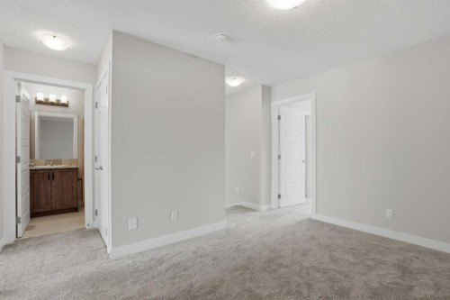 747 Creekside Boulevard Sw, Calgary, AB - Indoor Photo Showing Other Room
