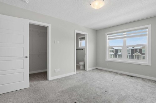 747 Creekside Boulevard Sw, Calgary, AB - Indoor Photo Showing Other Room