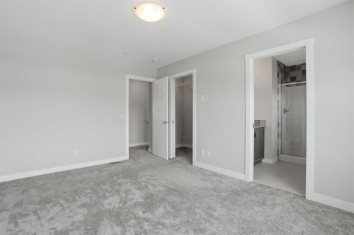 747 Creekside Boulevard Sw, Calgary, AB - Indoor Photo Showing Other Room