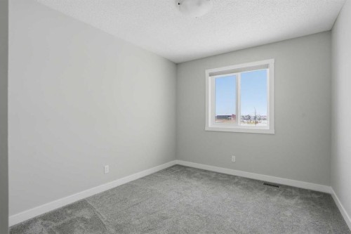 747 Creekside Boulevard Sw, Calgary, AB - Indoor Photo Showing Other Room