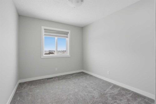747 Creekside Boulevard Sw, Calgary, AB - Indoor Photo Showing Other Room