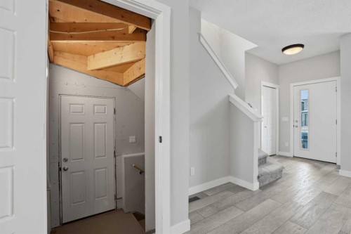 747 Creekside Boulevard Sw, Calgary, AB - Indoor Photo Showing Other Room
