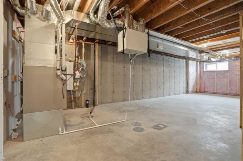 747 Creekside Boulevard Sw, Calgary, AB - Indoor Photo Showing Basement