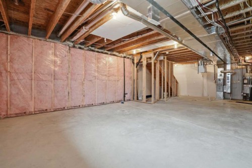 747 Creekside Boulevard Sw, Calgary, AB - Indoor Photo Showing Basement