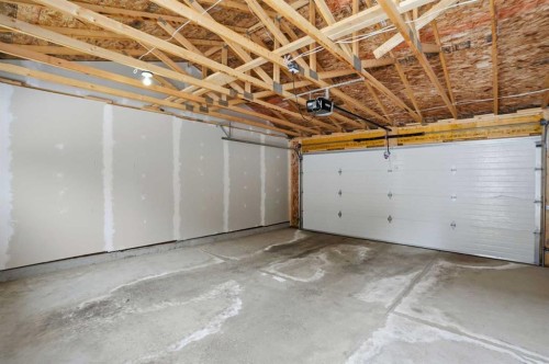 747 Creekside Boulevard Sw, Calgary, AB - Indoor Photo Showing Garage