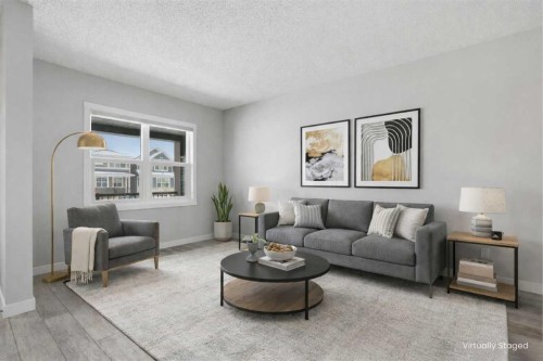 747 Creekside Boulevard Sw, Calgary, AB - Indoor Photo Showing Living Room