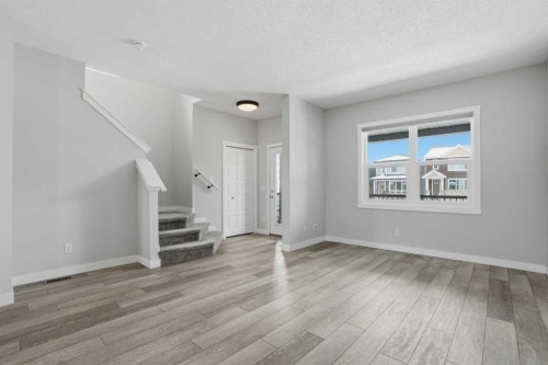 747 Creekside Boulevard Sw, Calgary, AB - Indoor Photo Showing Other Room