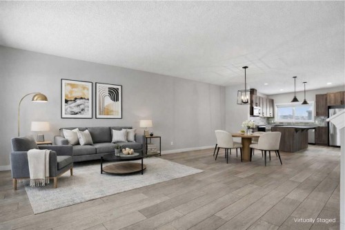 747 Creekside Boulevard Sw, Calgary, AB - Indoor Photo Showing Living Room