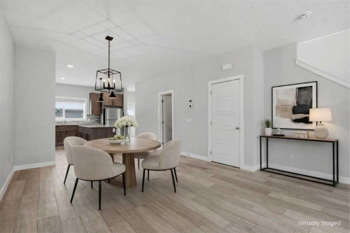 747 Creekside Boulevard Sw, Calgary, AB - Indoor Photo Showing Dining Room