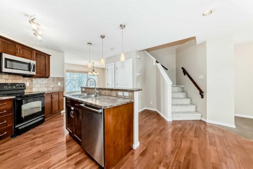 46 Panatella Hill Nw, Calgary, AB - Indoor Photo Showing Kitchen With Double Sink