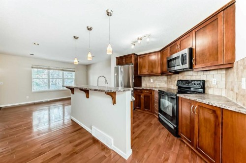 46 Panatella Hill Nw, Calgary, AB - Indoor Photo Showing Kitchen With Upgraded Kitchen