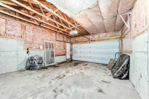 46 Panatella Hill Nw, Calgary, AB - Indoor Photo Showing Garage