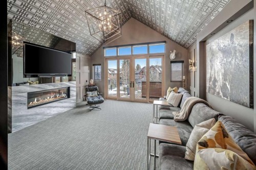 23 Spring Willow Way Sw, Calgary, AB - Indoor Photo Showing Living Room With Fireplace