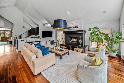 23 Spring Willow Way Sw, Calgary, AB - Indoor Photo Showing Living Room With Fireplace