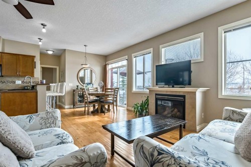 79 Tucker Circle, Okotoks, AB - Indoor Photo Showing Living Room With Fireplace