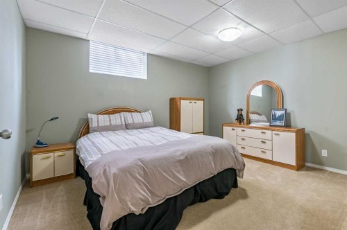 79 Tucker Circle, Okotoks, AB - Indoor Photo Showing Bedroom