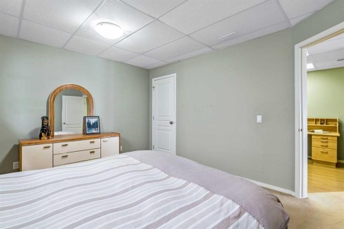79 Tucker Circle, Okotoks, AB - Indoor Photo Showing Bedroom