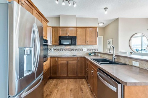 79 Tucker Circle, Okotoks, AB - Indoor Photo Showing Kitchen With Double Sink