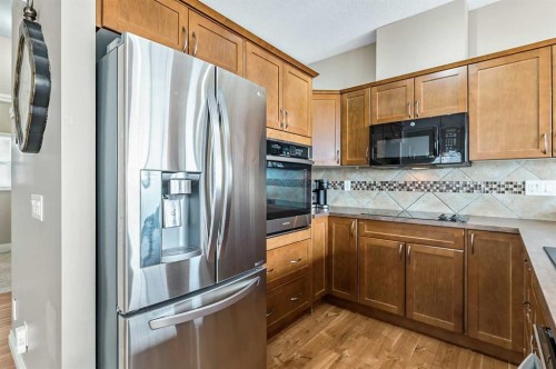 79 Tucker Circle, Okotoks, AB - Indoor Photo Showing Kitchen With Double Sink