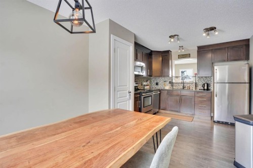 39 Panatella Road Nw, Calgary, AB - Indoor Photo Showing Kitchen With Stainless Steel Kitchen