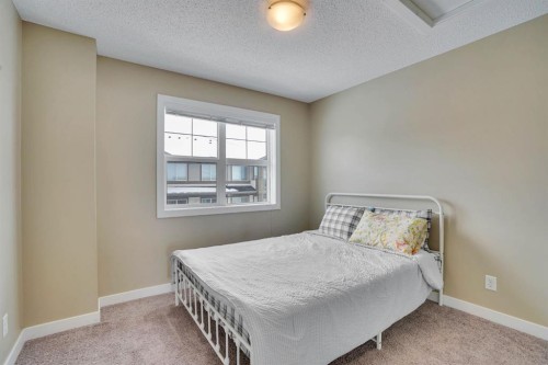 39 Panatella Road Nw, Calgary, AB - Indoor Photo Showing Bedroom