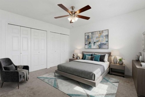 1-12 Silver Creek Boulevard Nw, Airdrie, AB - Indoor Photo Showing Bedroom
