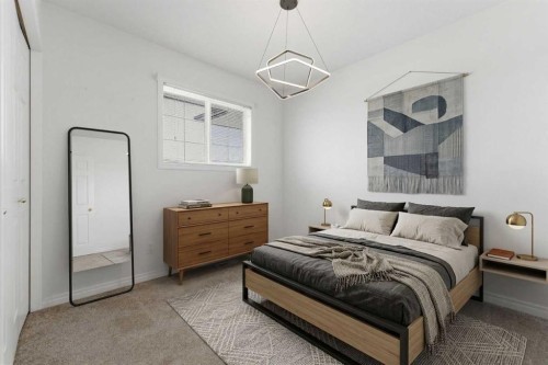 1-12 Silver Creek Boulevard Nw, Airdrie, AB - Indoor Photo Showing Bedroom