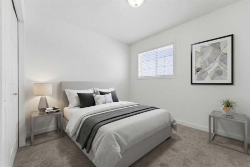1-12 Silver Creek Boulevard Nw, Airdrie, AB - Indoor Photo Showing Bedroom