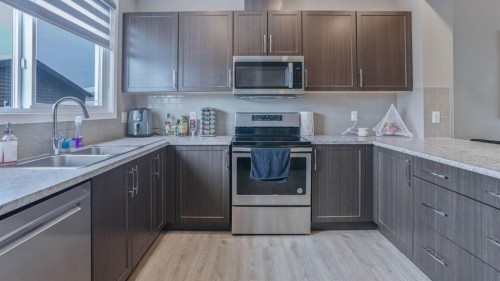 62 Corner Meadows Common Ne, Calgary, AB - Indoor Photo Showing Kitchen With Double Sink With Upgraded Kitchen