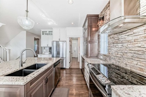 322 Reunion Green Nw, Airdrie, AB - Indoor Photo Showing Kitchen With Stainless Steel Kitchen With Double Sink With Upgraded Kitchen
