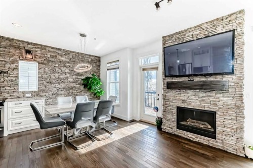 322 Reunion Green Nw, Airdrie, AB - Indoor Photo Showing Living Room With Fireplace