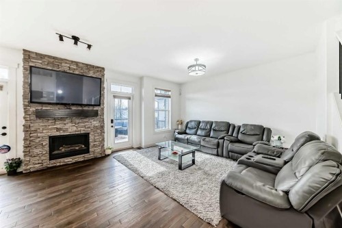 322 Reunion Green Nw, Airdrie, AB - Indoor Photo Showing Living Room With Fireplace