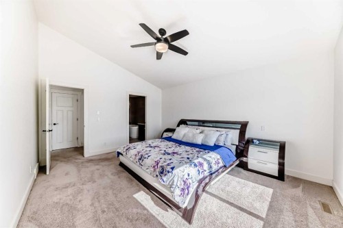 322 Reunion Green Nw, Airdrie, AB - Indoor Photo Showing Bedroom