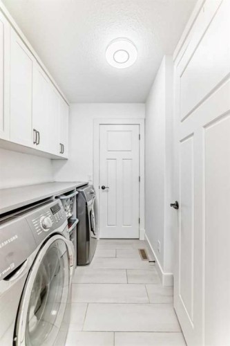 322 Reunion Green Nw, Airdrie, AB - Indoor Photo Showing Laundry Room