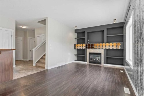 420 Ranch Ridge Meadow, Strathmore, AB - Indoor Photo Showing Other Room With Fireplace