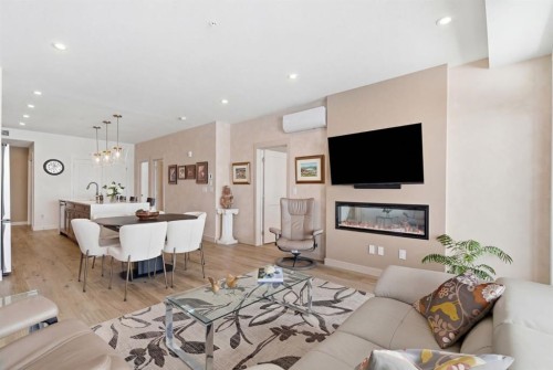 7306-1802 Mahogany Boulevard Se, Calgary, AB - Indoor Photo Showing Other Room With Fireplace