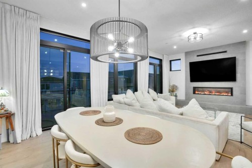 54 Calhoun Crescent Ne, Calgary, AB - Indoor Photo Showing Dining Room With Fireplace