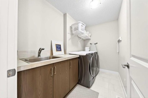 13 Cranbrook Close Se, Calgary, AB - Indoor Photo Showing Laundry Room