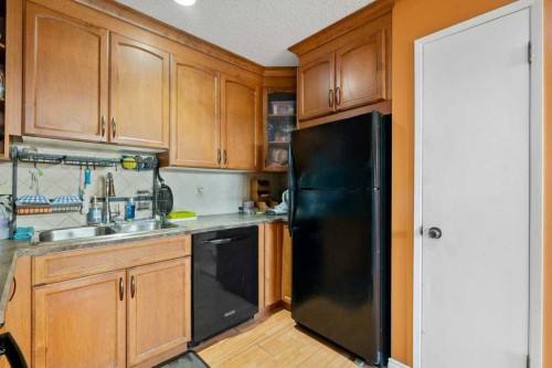 113 Ranch Glen Place Nw, Calgary, AB - Indoor Photo Showing Kitchen With Double Sink