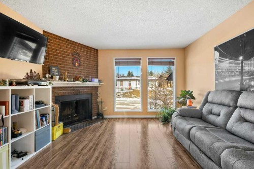 113 Ranch Glen Place Nw, Calgary, AB - Indoor Photo Showing Living Room With Fireplace